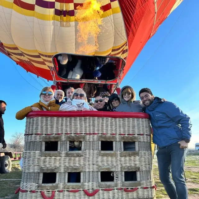 A group in a hot-air balloon basket before take-off, Cappadocia