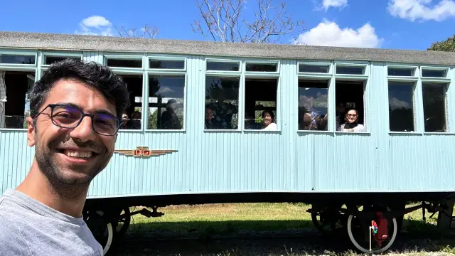 A group in a vintage carriage at the railway museum