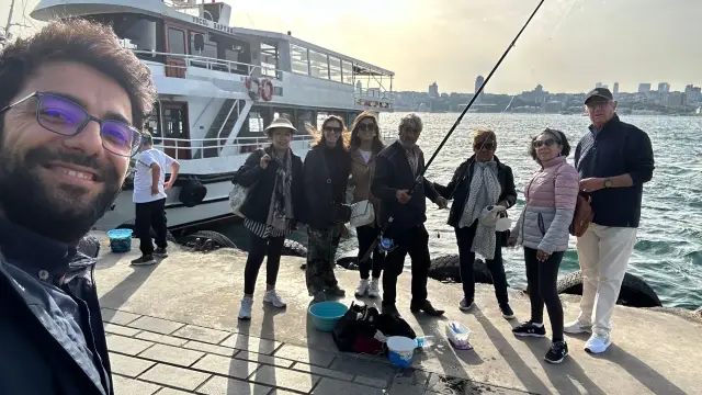 Walking along the Bosphorus on the Asian side, with a local fisherman